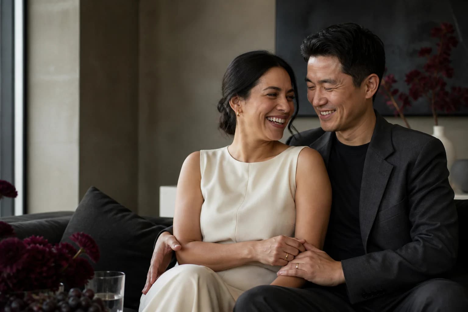 A newly married couple sharing a quiet laugh at home